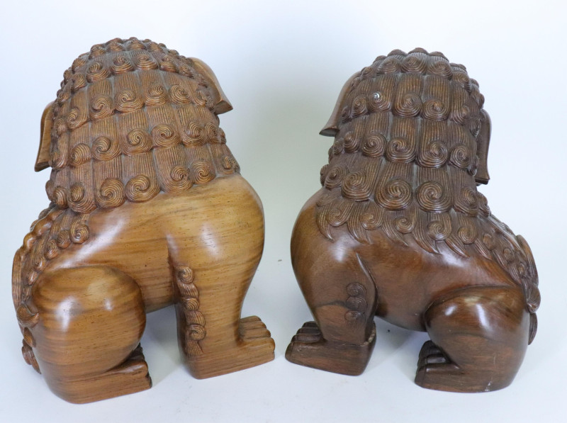 Matching Hardwood Stands with two Carved Foo Dogs
